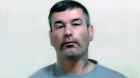 Police Scotland Police mugshot of murderer Owen Grant looking at camera.