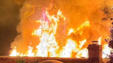 A house in Malibu is on fire