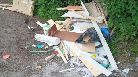 Supplied A closer view of the rubbish, with wooden boards and posts jumbled amongst an assortment of plastic.