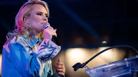 Getty Images Aftyn Behn gives a concession speech