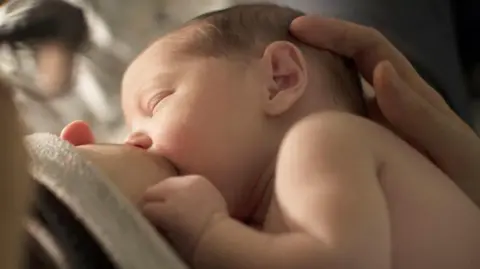 A baby being breastfed