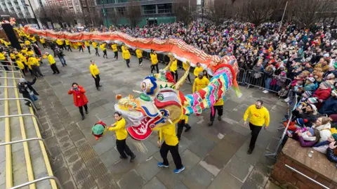 PA Media Performers take part in the Dragon Parade as part of Manchester's Chinese New Year Celebrations in 2023.