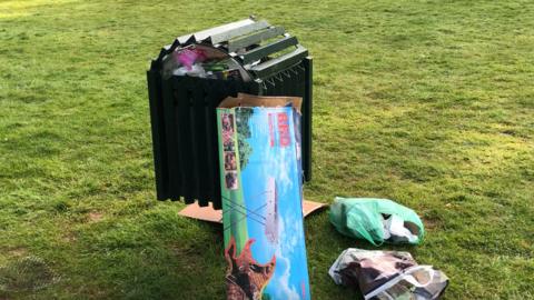 Rubbish left near a bin at Needham Lakes
