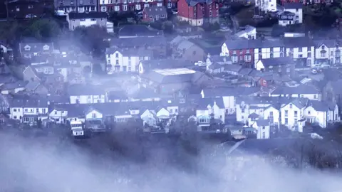Wintry conditions over houses in Llangollen, Denbighshire