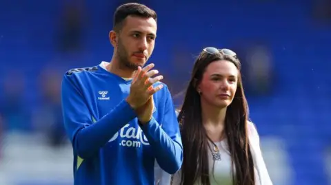 Dwight McNeil and Megan Sharpley 