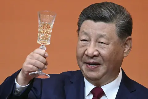 AFP via Getty Images China's President Xi Jinping makes a toast during a state banquet for US President Donald Trump at the Great Hall of the People in Beijing on May 14, 2026.
