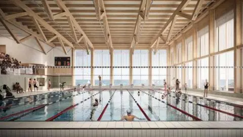 Brighton & Hove City Council An artist's impression of the swimming pool inside the new King Alfred Leisure Centre, showing the pool divided into swimming lanes under a roof of white metal girders, with floor to ceiling windows on two sides of the pool and a spectator gallery on one side.