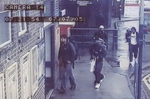 PA Media Metropolitan Police handout photo issued Saturday July 16 2005 of a CCTV image of the four London bombers arriving at Luton train station at 0721 on Thursday July 7. The image shows from left to right Hasib Hussain, Germaine Lindsay (dark cap), Mohammed Sidique Khan (light cap) and Shahzad Tanweer.