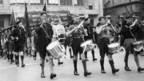 The 5th Bristol Scout Group at a march in the 1950s 