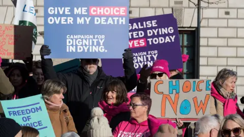 Getty Images Campaigners gather in Parliament Square to demonstrate their support for assisted dying as Kim Leadbeater MP's bill in November 2024.