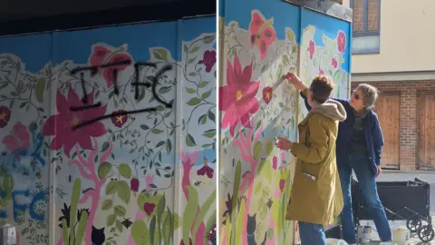 Left image shows Ipswich Town Football Club's initials drawn with black paint on a colourful, floral mural drawn on hoardings. The right image depicts two women painting over the graffiti, with tins of paint by their feet