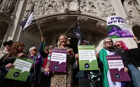 EPA-EFE/REX/Shutterstock Women celebrate outside the Supreme Court in London, Britain, 16 April 2025, following its ruling that the definition of a woman is based on biological sex.