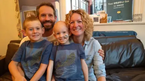 GIANT PLEDGE TO HELP BEAT CHILDHOOD CANCER The Woodall family 