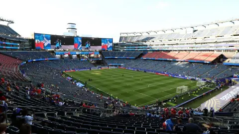 Getty Images Scotland fans seated waiting for the Scotland Haiti match to begin but many seats are still empty