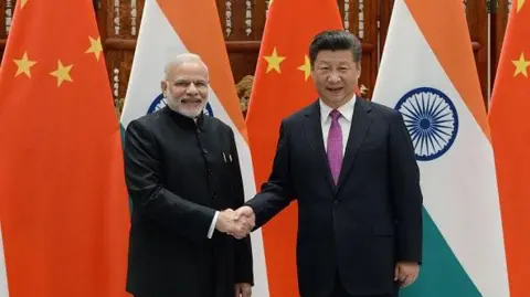 Getty Images Prime Minister Narendra Modi shakes hands with Chinese President Xi Jinping (right) at the West Lake State Guest House in September 2016 in Hangzhou, China during the G20 Leaders' Summit 