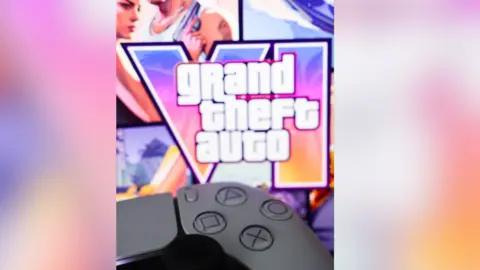 A playstation controller in front of the Grand Theft Auto 6 logo.