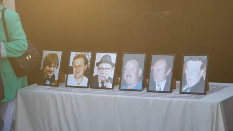 Pacemaker Press Framed pictures of the six men that died on display