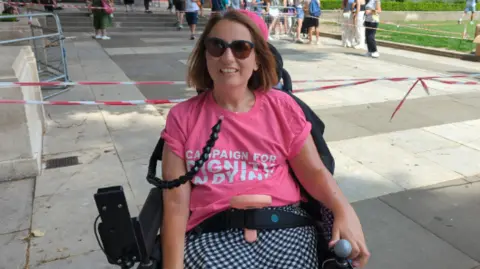 Emma in her adapted wheelchair