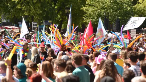 PA People taking part in the Belfast Pride Parade 2023.