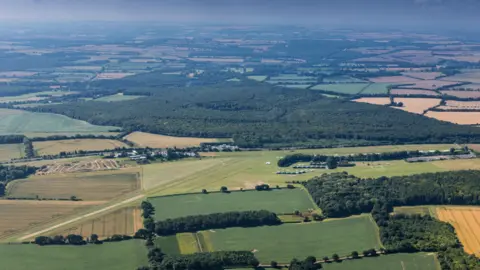 An aerial photograph of Popham Airfield, Located to the north of the A303 dual carriageway, 7 miles south west of Basingstoke