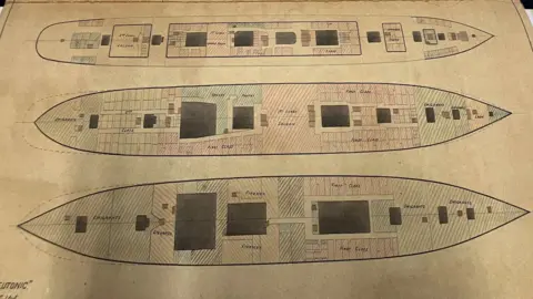 A close up of some of the technical plans for Titanic - showing three of the ship's decks. The drawing is precise in a technical style in pencil.