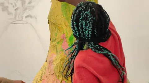 KRAN A girl taking part in the workshops to create the exhibition