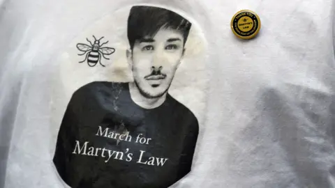 PA Media Campaign t-shirt with face of Martyn's Hett, calling for Martyn's Law