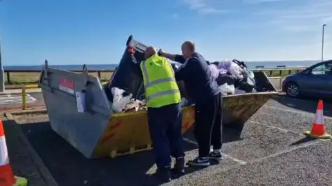 Martin Emmerson Bin being emptied into skip at Whitburn car park