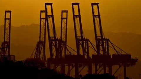 Getty Images The silhouettes of the container cranes in the Port of Balboa, managed a Hong Kong company 