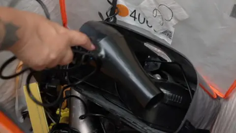 A breached  hairdryer being recycled