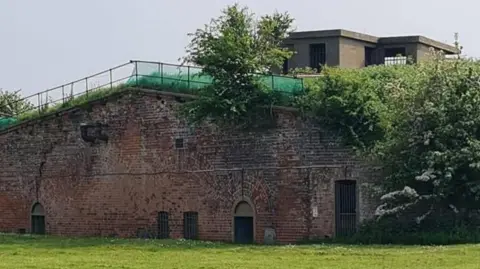 Nick Taylor A photo of the fort's brick armaments 