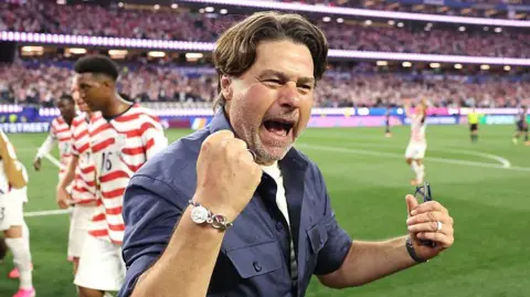 Mauricio Pochettino celebrates the USA's win against Paraguay