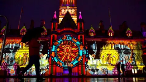 BD is LIT Colourful lights illuminate City Hall, a large Victorian building in Bradford.