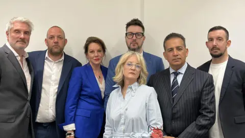 The families of the victims of Valdo Calocane - five men and two women.