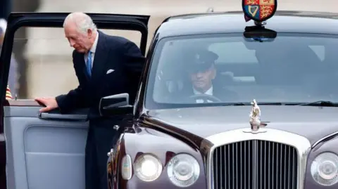 Getty Images King Charles III exiting his chauffeur driven Bentley State Limousine