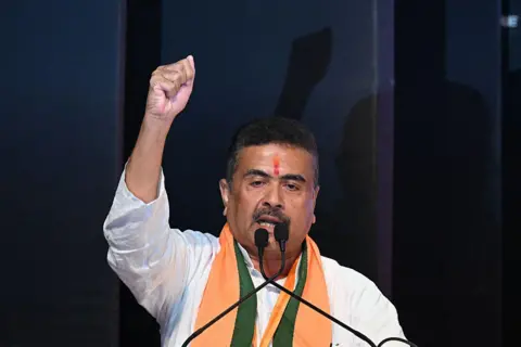 AFP via Getty Images Bharatiya Janata Party (BJP) leader and newly selected Chief Minister of West Bengal Suvendu Adhikari gestures during a party meeting in Kolkata on May 8, 2026. Indian Prime Minister Narendra Modi's party named a chief minister of West Bengal state on May 8, cementing its thumping win in key elections in the bastion long held by its adversary.
