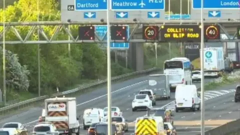 Traffic England The M1 shows a digital sign stating 'collision on slip road' with two red Xs showing the road cannot be accessed 