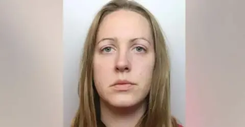 Cheshire Constabulary Lucy Letby stares straight ahead, unsmiling, in her police mugshot 