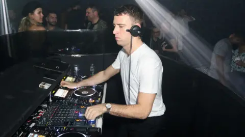 Getty Images Jackmaster spins during Prada Double Club Miami, A Carsten Holler Project at Ice Palace Film Studios on December 6, 2017 in Miami, Florida. 