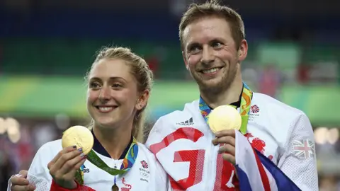 Laura and Jasno Kenny hold up their Olympic gold medals 