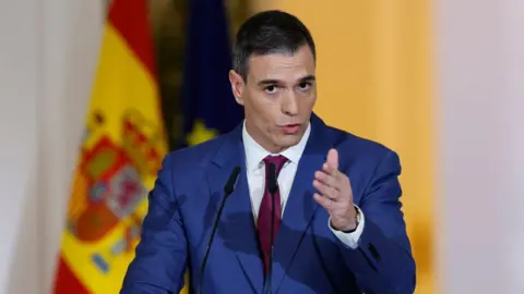 Spain's Prime Minister Pedro Sanchez gestures as he gives a press conference. 