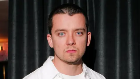 Getty Images Asa Butterfield looking serious as he stares into the camera