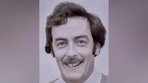 Rugby Borough Council A black and white picture of Philip Blundell. He has dark hair and a moustache.