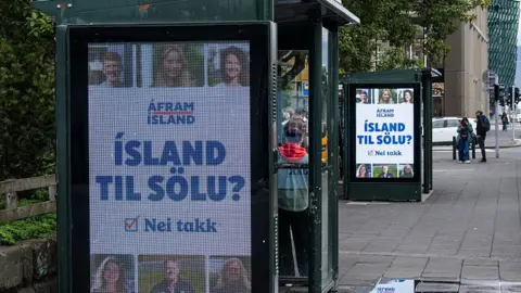 AFP via Getty Images This image taken on August 25, 2026 shows a campaign advertisement reading "Iceland for sale? No thanks" 