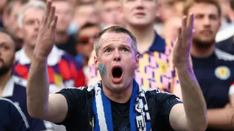 Getty Images A Scotland fan gesticulates