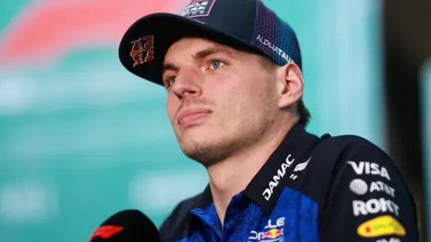 Red Bull's Max Verstappen speaking into an F1-branded microphone at the Miami Grand Prix
