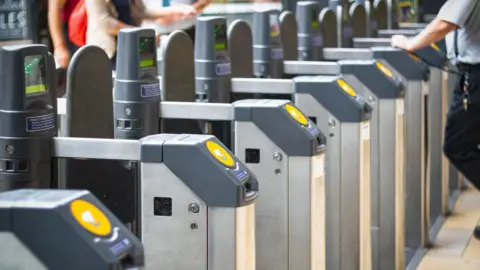 Getty Images A row of Tfl ticket barriers at a station 