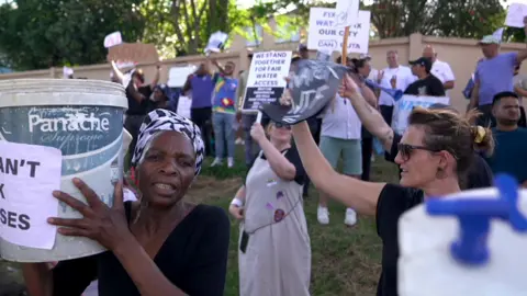 BBC People attend a protest about water issues