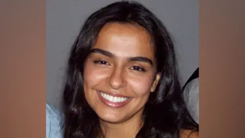 Shaina Sangha Shaina Sangha a woman with long black hair smiling at the camera.