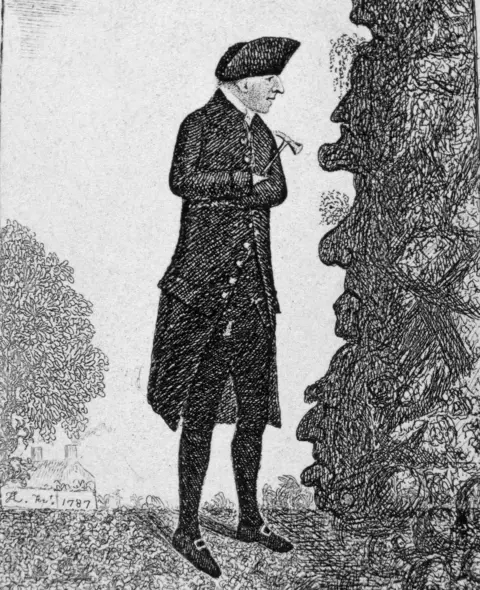 Getty Images A black and white drawing of Hutton looking at a rock face with a hammer in his hand. He is wearing a long black coat and black hat.